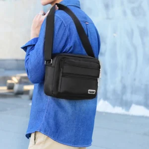 Men's business bag with double pockets, can be worn crossbody or over the shoulder, suitable for business trips.